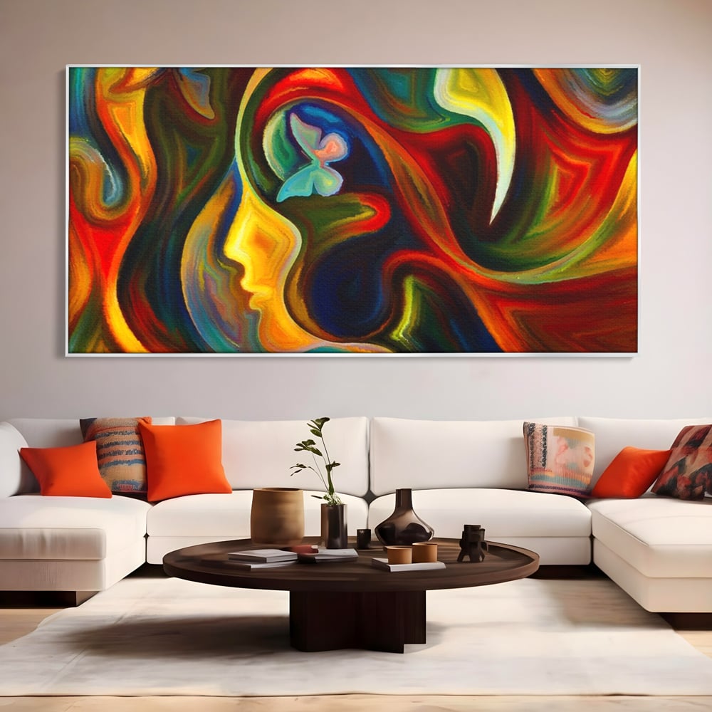 Tablou canvas cu pictura abstracta cu profil uman si fluturi, in rama de aluminiu argintiu, pe perete intr-un living